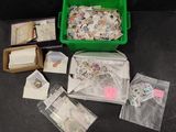 a green container filled with lots of stamps on a table