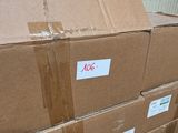 a large cardboard box sitting on top of a pile of boxes