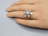 an image of a woman ' s hand with a diamond ring on it
