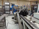 a machine that is working on a machine in a factory
