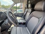 a view of the inside of a van from the driver ' s seat