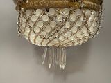 a close up of a chandelier hanging from a ceiling