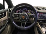the interior of a car with a steering wheel and dashboard controls