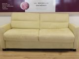 a couch that is sitting in front of a wall