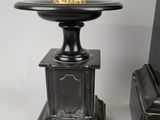 a vase that is sitting on a table next to a piano