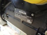 a close up of a motorcycle engine with a label on it