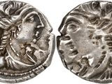 a silver coin with an image of a man and a woman on it