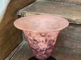 a vase that is sitting on a set of stairs