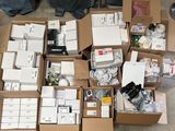 many boxes of electronic equipment sitting on the floor