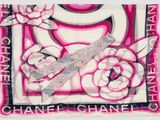 pink and white scarf with a picture of a pair of scissors on it