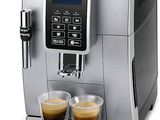 a close up of a coffee machine with two cups of coffee