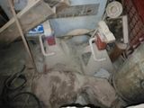 an image of a bathroom with a toilet and a trash can