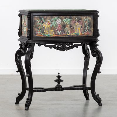 une table noire sur laquelle est posé un tableau