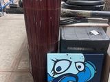 a box with a painting on it next to a bunch of sticks