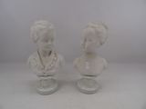 pair of white marble busts of a boy and a girl