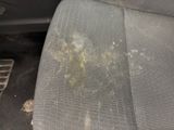 the dirty seat of a car with a lot of dirt on it