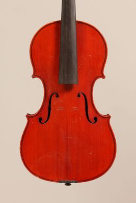 an old violin with a bow hanging from it ' s back