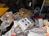 a pile of electronics that is sitting on a table