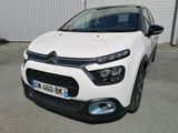 l'avant d'une Citroën blanche garée sur un parking