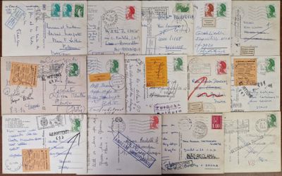 many postcards on the table with writing on them