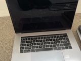 a laptop that is sitting on the floor next to a mouse