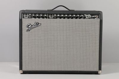 a close up of a guitar amplifier sitting on top of a table