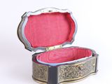 a small box that has a red lining inside of it