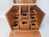 a wooden box that has six compartments in it