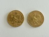 two gold sovereigns, one of which is a lion and the other of which is a horse