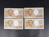 four different bank notes with a picture of a man and a woman on them