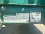 a close up of a green truck with a price tag on it