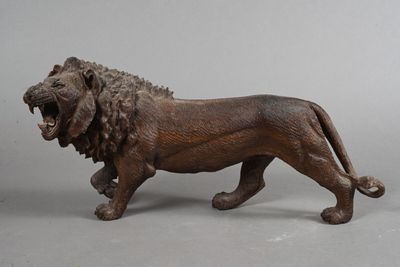 a statue of a lion with its mouth open