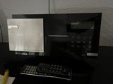 a computer monitor and a keyboard on a desk