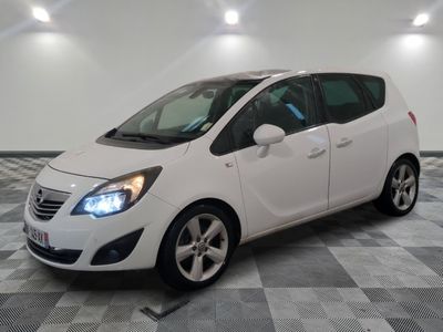 a picture of a white opel parked in a garage