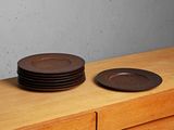 two plates sitting on top of a wooden counter