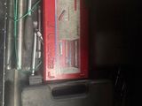a picture of a red and black box with wires and wires