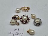 a close up of a bunch of jewelry on a white surface
