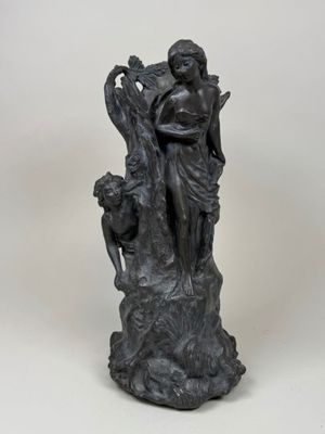 an image of a statue of a woman holding a child
