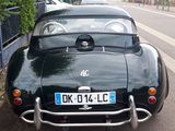 a black car parked on the side of the street