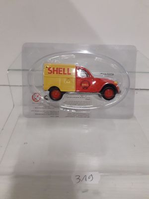 a toy truck with a shell sign on it