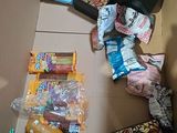 a cardboard box filled with assorted food and snacks