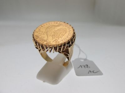 l'image d'un anneau d'or surmonté d'une pièce de monnaie