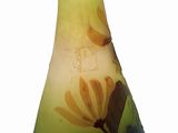 a glass vase with a yellow and black design on it