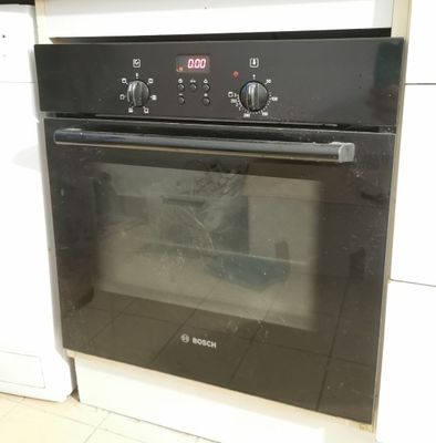 a black oven that is built into the wall