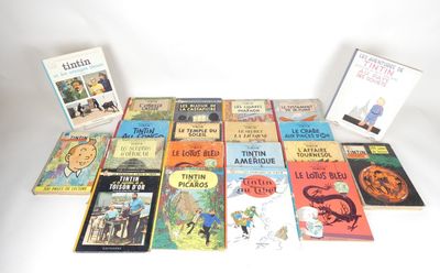 several children ' s books are lined up on a white surface