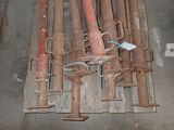 a pile of old rusted tools on a pallet