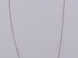 silver and gold necklace with a round pendant on a chain
