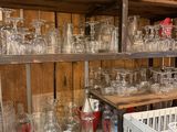 many glassware on the shelves in the kitchen