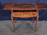 an old wooden table with a drawer on top of it