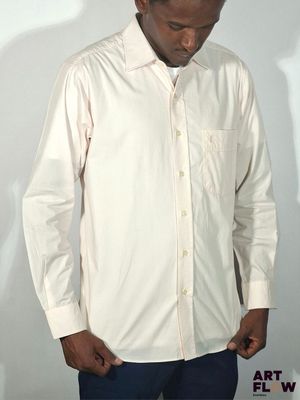 a man in a white shirt and blue jeans